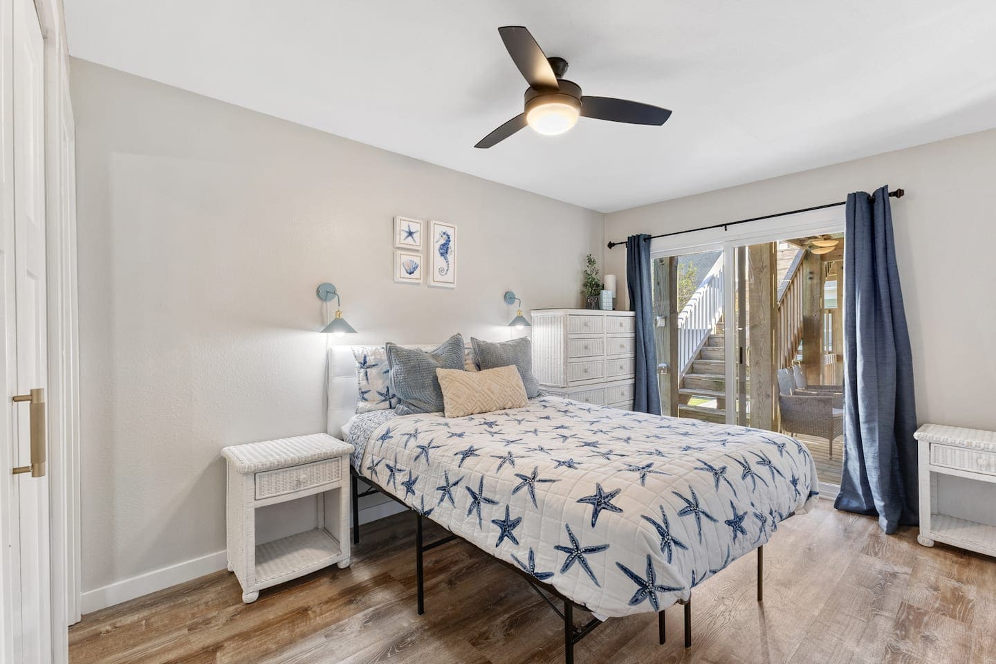 Bedroom with starfish quilt and navy curtains