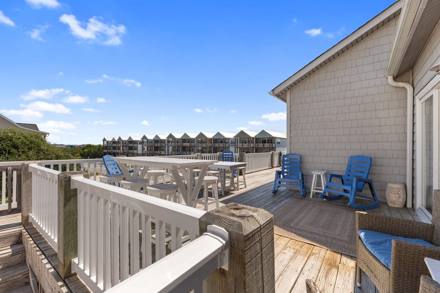 Upper deck dining set and blue rocking chairs