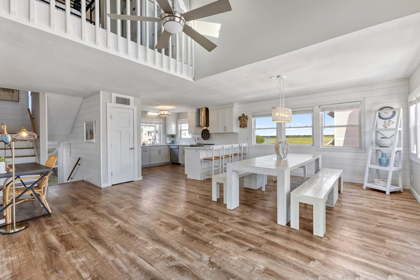 Open dining table with benches overlooking the marsh