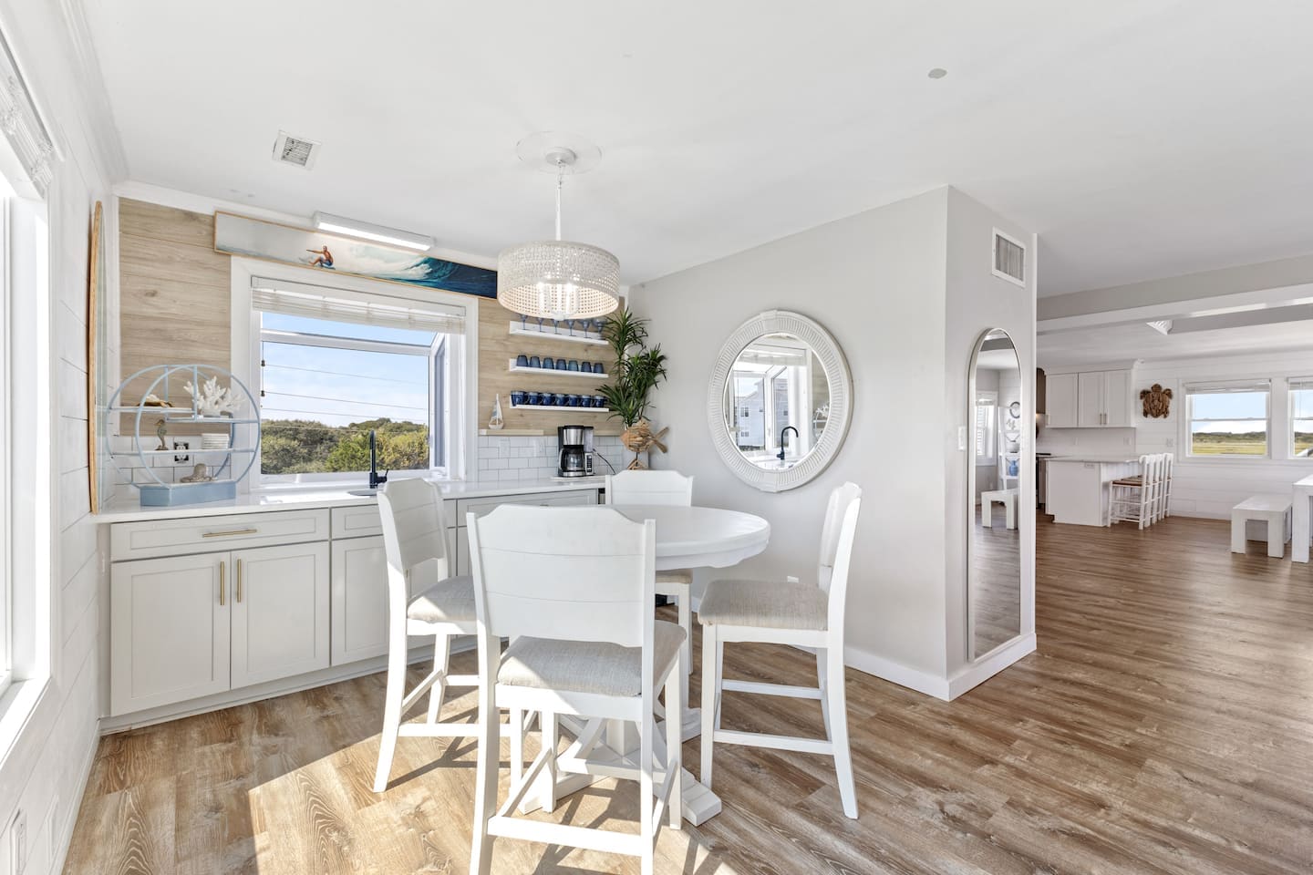 High-top dining and wet bar with coastal glassware