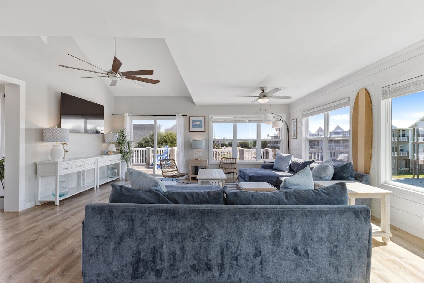 Bright living room with deck access and coastal blues