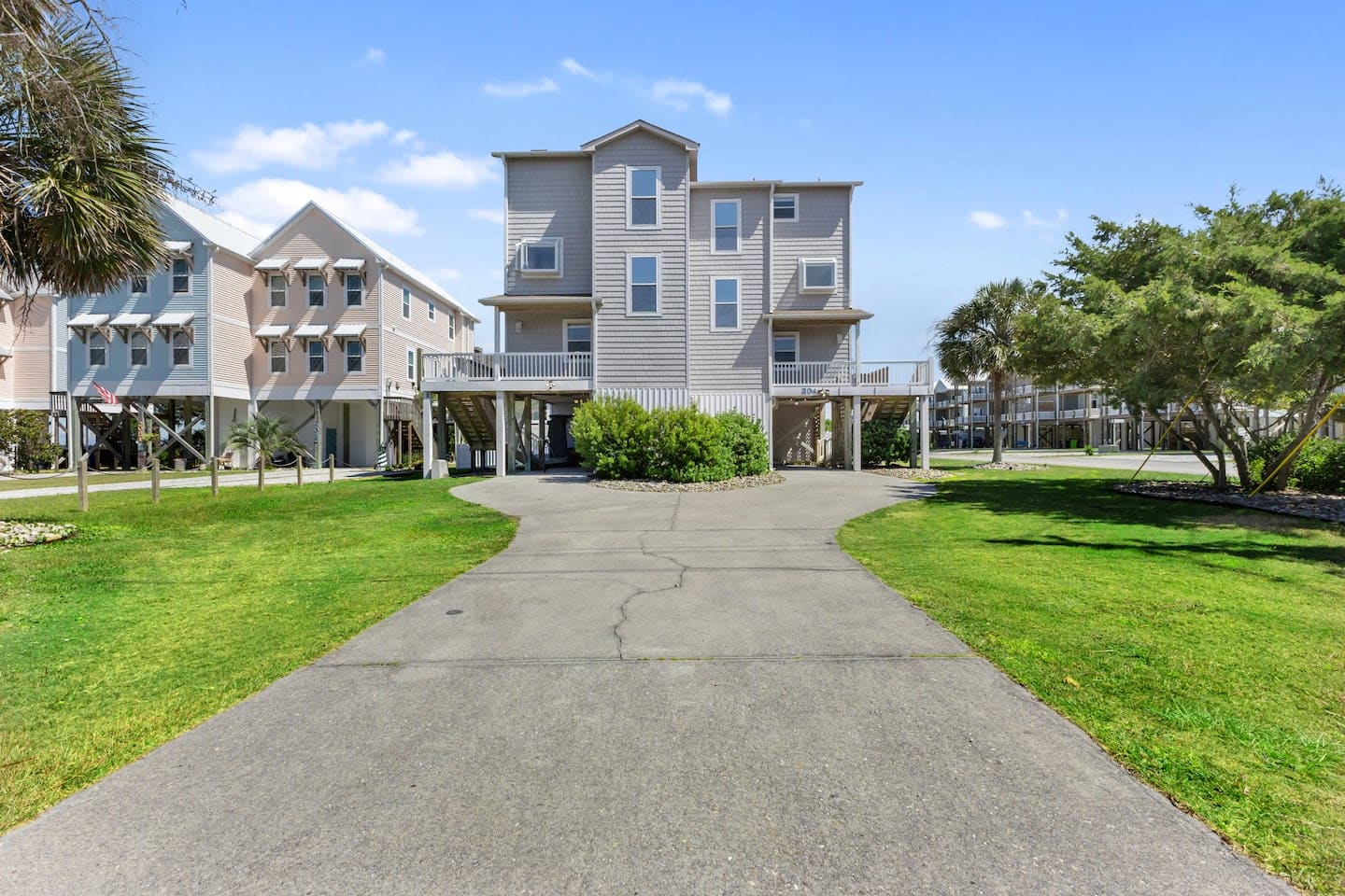 Driveway approach to the three-story coastal home