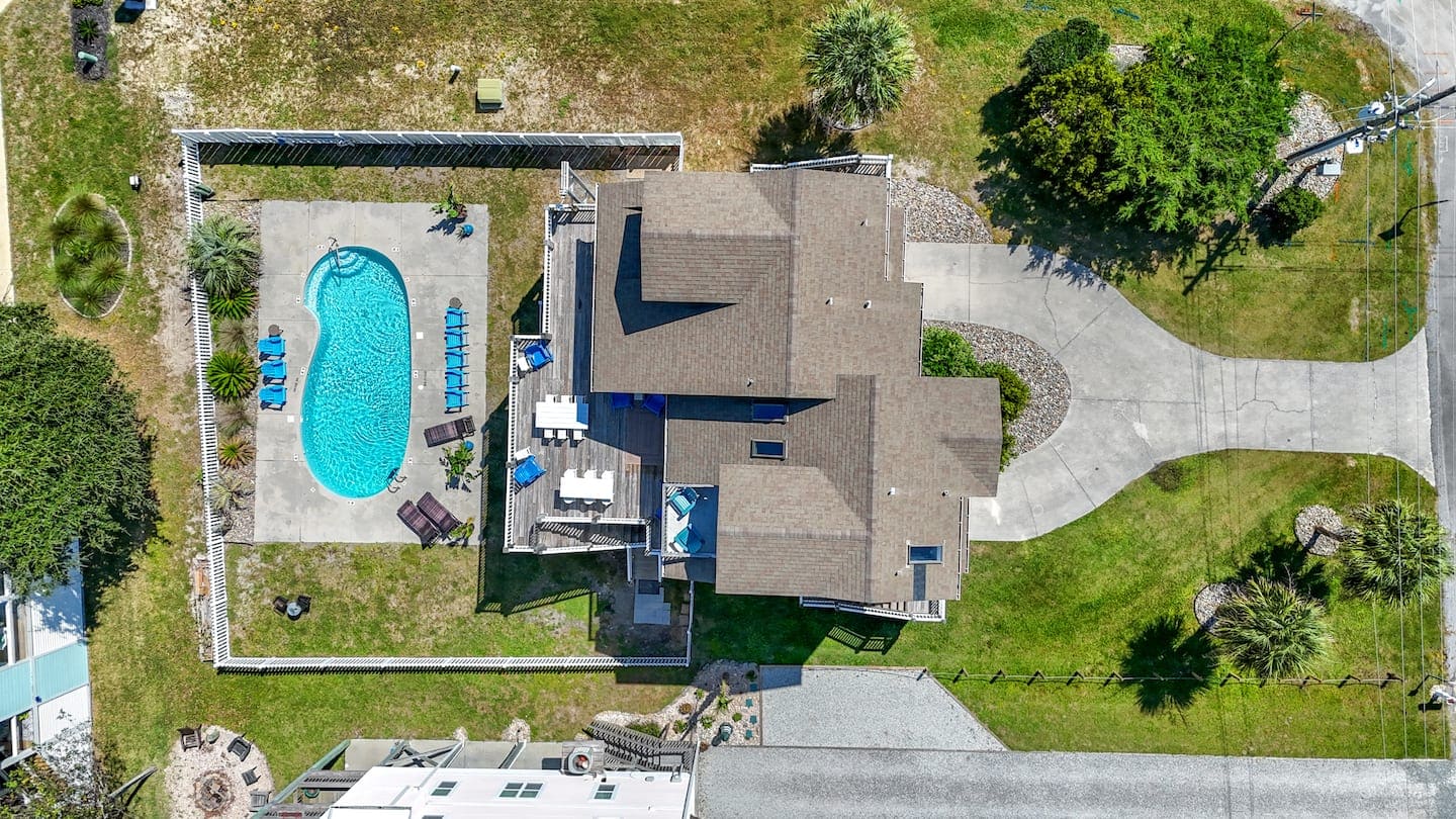 Aerial view of the house, pool, and outdoor decks