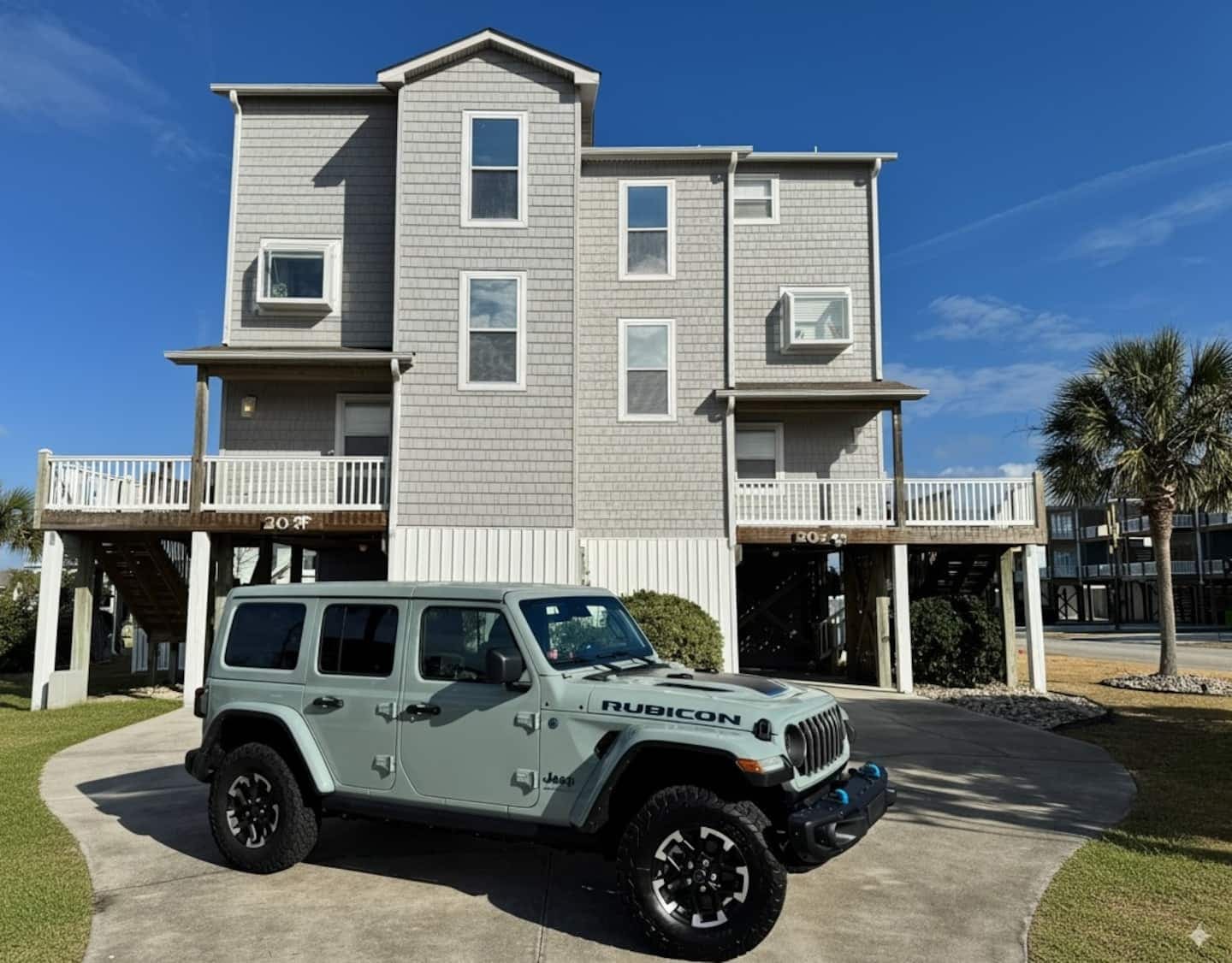 Street-side exterior with coastal gray siding and white trim