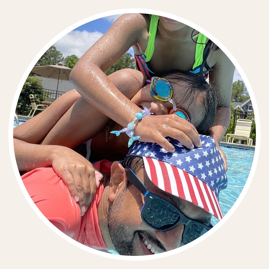 Dipen with his kids in the pool