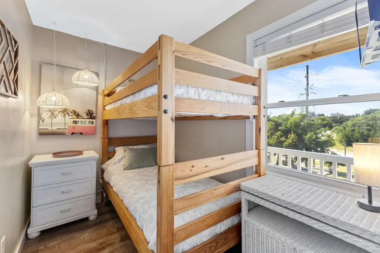 Wooden bunk bed in one of the kids' bunk rooms at Topsail Paradise