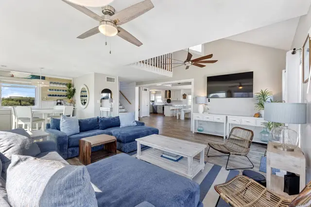 Open living room flowing into kitchen and dining